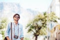 Photographer, happy man or tourist on holiday, vacation or trip for a fun adventure in Italy with sunglasses. Summer