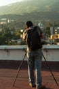 Man taking photo on rooftop