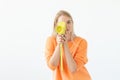 Photographer, hobby and leisure concept - Young blond woman with retro camera on white background Royalty Free Stock Photo