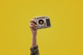 Photographer holding a vintage camera in closeup view hand Royalty Free Stock Photo