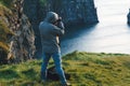Photographer making photos of cliffs of moher