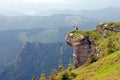 Photographer on a huge rock Royalty Free Stock Photo