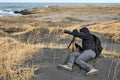 Photographer in Iceland, black sand beach Royalty Free Stock Photo