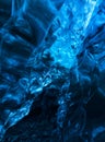 Photographer inside a blue ice cave Royalty Free Stock Photo