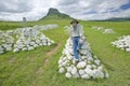 Photographer Joe Sohm at Sandlwana hill or Sphinx with soldiers graves in foreground, the scene of the Anglo Zulu battle site of Royalty Free Stock Photo