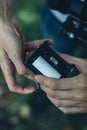 Photographer loading medium format film into the film back Royalty Free Stock Photo