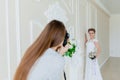 Photographer taking pictures the young bride in the studio Royalty Free Stock Photo