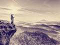 Photographer looks into the landscape and listen the silence. Man prepare camera to takes photos Royalty Free Stock Photo