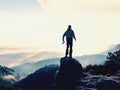 Photographer looks into the landscape and listen the silence. Man prepare camera to takes photos Royalty Free Stock Photo