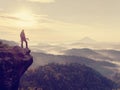 Photographer looks into the landscape and listen the silence. Man prepare camera to takes photos Royalty Free Stock Photo