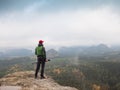 Photographer at misty sunrise. Rainy misty day