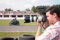 Photographer on motorcycle race Royalty Free Stock Photo