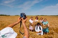 Photographer at outdoor is taking photo of people in season of harvest Royalty Free Stock Photo