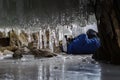 Photographer photographed in the grotto icicle.