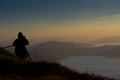 Photographer photographed mist and sky On a high mountain in the morning Royalty Free Stock Photo