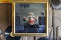 The photographer photographed a parody of the shadow in the mirror and the mask. Mask is a mask Thai karma art
