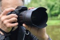 The photographer is photographing with the camera