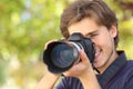 Photographer photographing and learning with a dslr digital camera