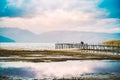 photographer on a pier of a lake prespa macedonia Royalty Free Stock Photo