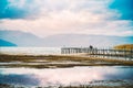 photographer on a pier of a lake prespa macedonia
