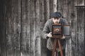 Photographer prepares for shooting on large format camera. Concept - photography of the 1930s-1950s Royalty Free Stock Photo