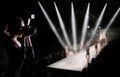 Photographer Press Woman use Camera to shoots Photo of Fashion Week Show which Model Supermodel walk on Runway Catwalk for New