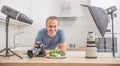 Photographer professional in her studio kitchen with equipment c Royalty Free Stock Photo