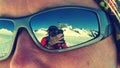 Photographer reflected on sunglasses while climbing MÃÂ¶nch mountain in the Alps, Switzerland Royalty Free Stock Photo