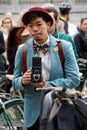 Photographer with retro camera wearing old fashioned clothes