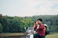 Photographer riding a motor scooter on road. Traveled by scooter slow life on vacation resting time Royalty Free Stock Photo