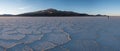 Photographer in salt desert Royalty Free Stock Photo