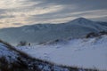 Photographer at Sarykum barchan in winter Royalty Free Stock Photo