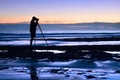 Photographer at the sea in the dusk Royalty Free Stock Photo