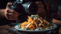 The photographer shoots nachos with cheese, vegetables and herbs.