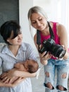 Photographer shows the resulting photo of newborn Royalty Free Stock Photo