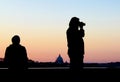 Photographer silhouette against Rome skyline