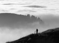 Photographer silhouette over fog