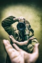 Photographer stalker, military correspondent with a camera in military uniform in a protective gas mask closeup Royalty Free Stock Photo