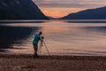 Photographer sunset lake mountains