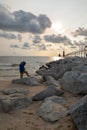 A photographer and sunset lighthouse in a cloudy day at Grant Heaven Lake Michigan Royalty Free Stock Photo