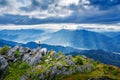 Photographer take a photo and standing on top of the rock in nature. Travel concept.