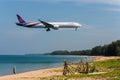 Photographer take picture of Malaysian airlines airplane ,boeing 777, landing at phuket airport