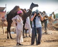 Photographer take pictures at the Pushkar Fair, India