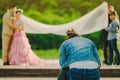 Photographer take pre-wedding photos of the bride and groom in t