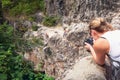 Photographer takes photo of boy who is jumping into the river fr