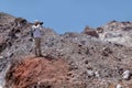 Photographer takes a photo in deserted area Hormuz Island, Iran Royalty Free Stock Photo