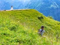 Photographer takes photos of the bride and groom against the background of mountain landscapes