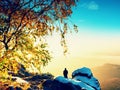 Photographer takes photos with camera on snowy peak