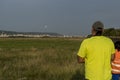 A photographer takes photos of take-off and landing planes