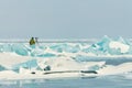 Photographer takes pictures frozen clear ice in winter lake baikal, russia